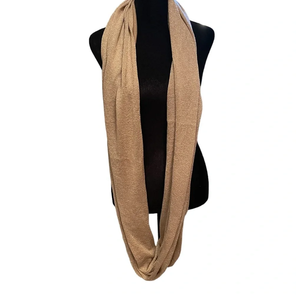 Pale pink infinity scarf with‎ gold threads.
